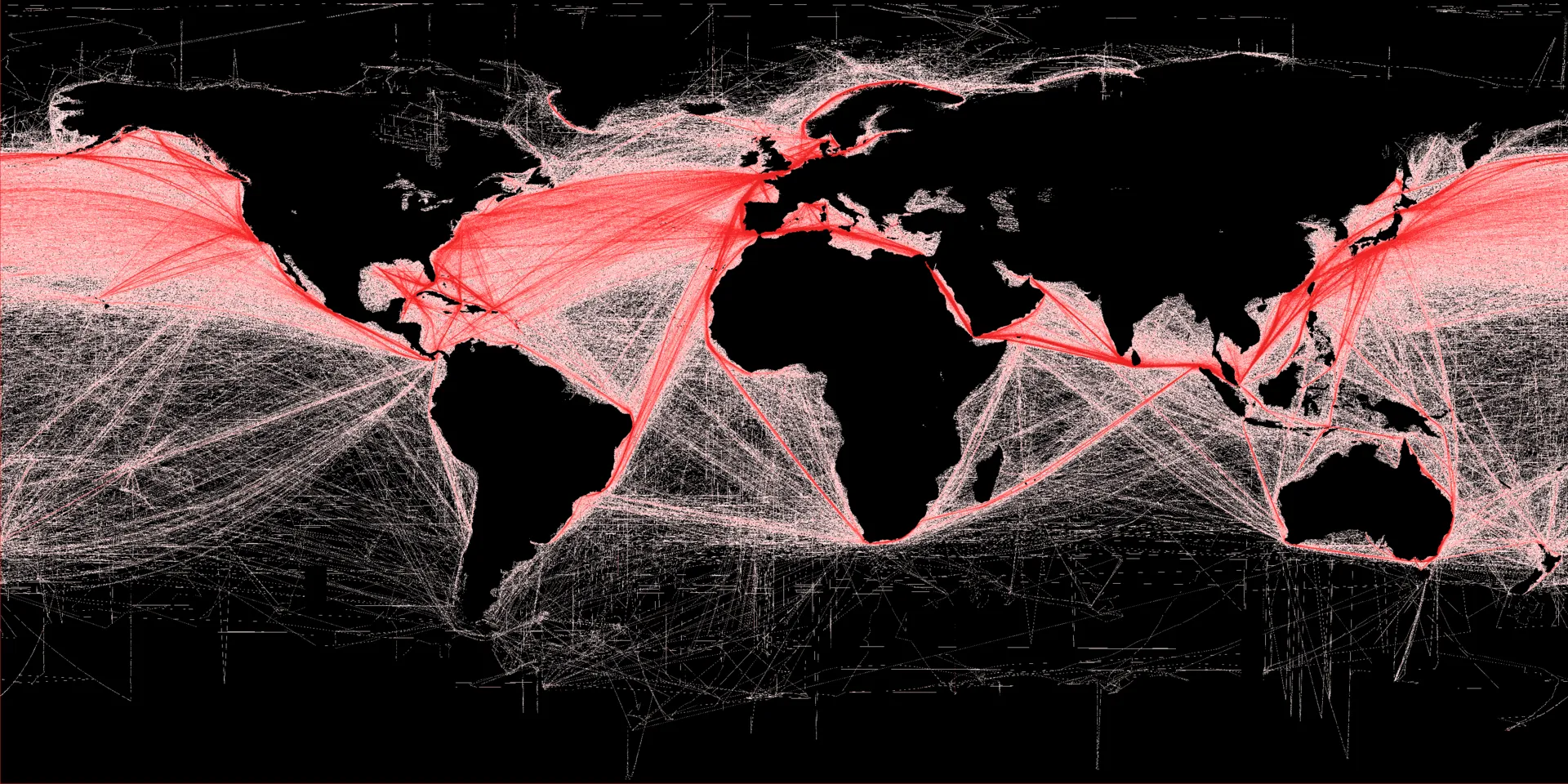 Planisphère sur fond noir où l'intensité rouge représente la densité relative de la navigation commerciale.